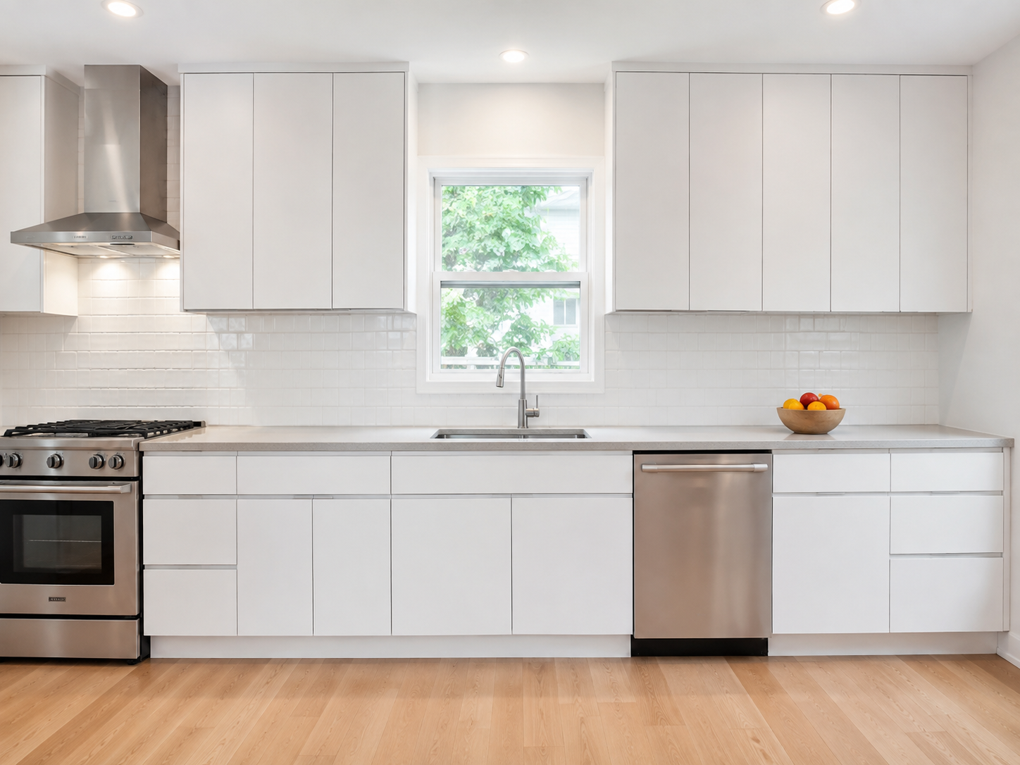 A kitchen with white cabinet doors before any changes